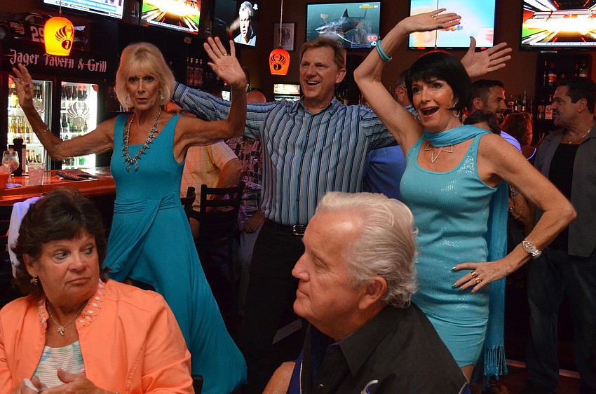 Barbara Bostic, Peter Salefsky and Kay Siebold dance to the music
