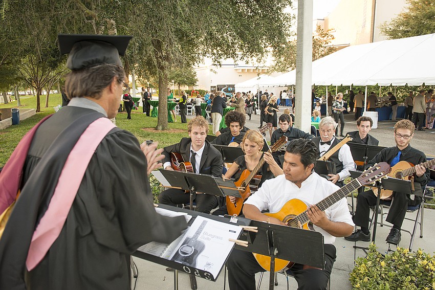 Rex Willis directs SCFâ€™s Guitar Ensemble at the reception following the inauguration of SCF President Dr. Carol F. Probstfeld.