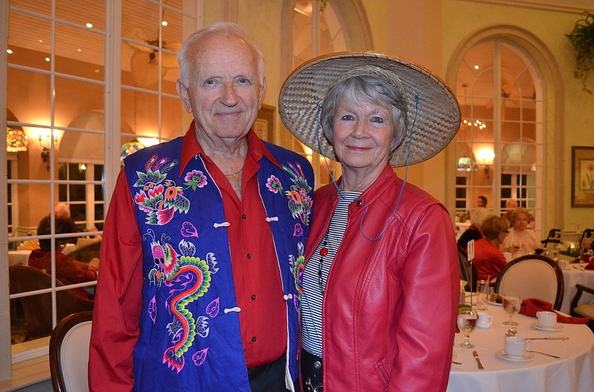 Norman and Carole Malcolm wear Chinese clothes from a trip in 1987.