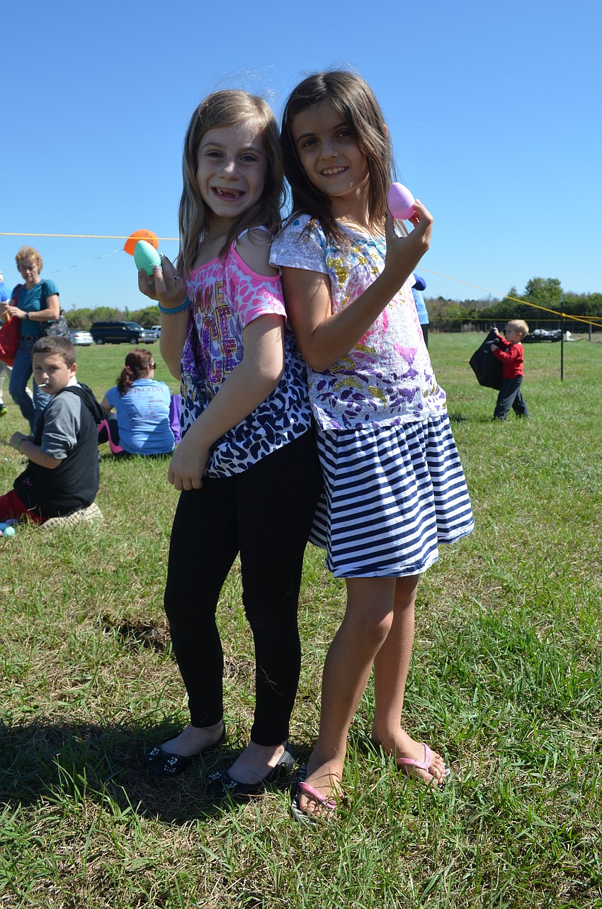 Olivia Schnell and Nova Pollard with their eggs.