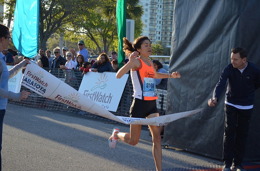 Sara Petrick is the first woman to cross the finish line.