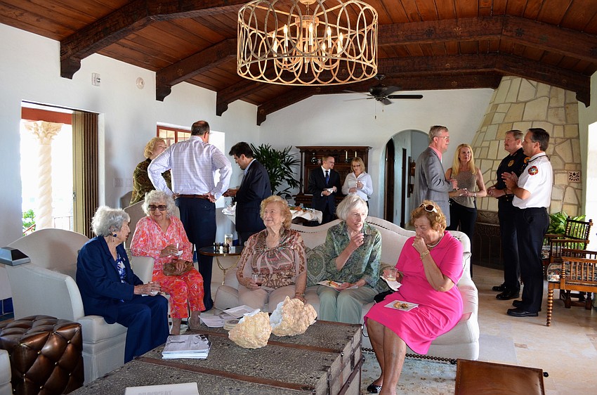 Attendees mingle and admire the renovations made to the community room.
