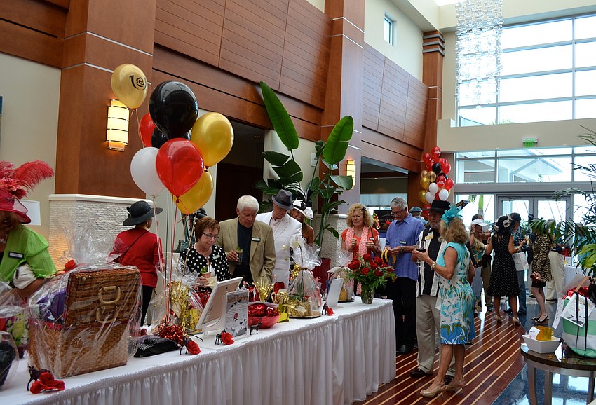 Attendees look through the items up for auction.