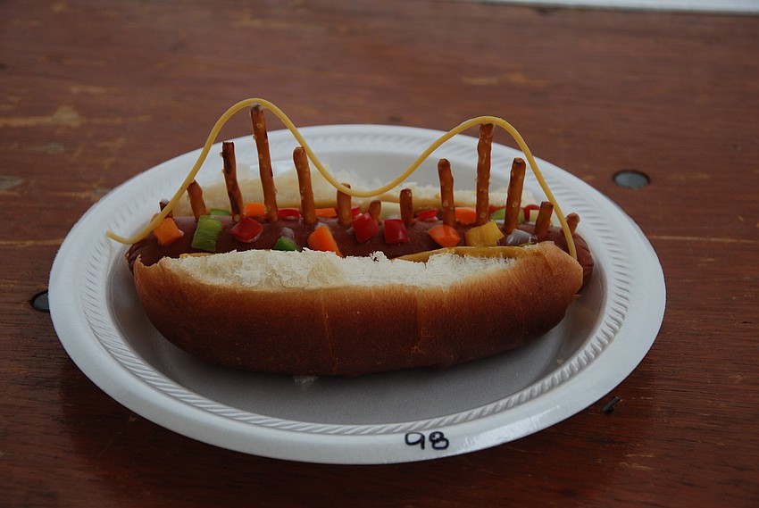 First-place winner of the Kids Hotdog Cook-off, Brandon Wolf, 7, smiles for a picture after winning the hotdog contest with his hotdog creation of the Skyway Bridge.
