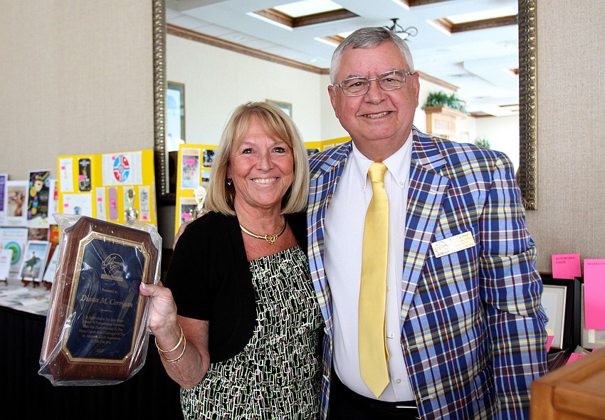 Executive Director Diana Corrigan received an award for all her hard work throughout the year from 2nd Vice President Bill Carman.