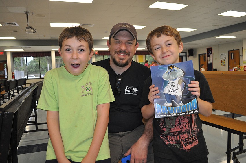 Tom McAndrew with his sons, Thomas and Owen, fourth and second graders respectively at Bashaw Elementary School; Owen looks forward to art class and P.E.