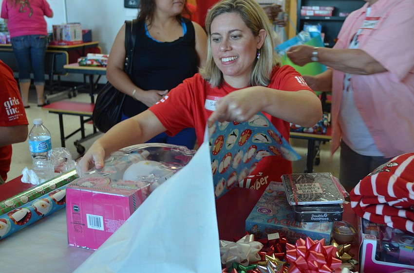 Salena Stock wraps a Hello Kitty toy