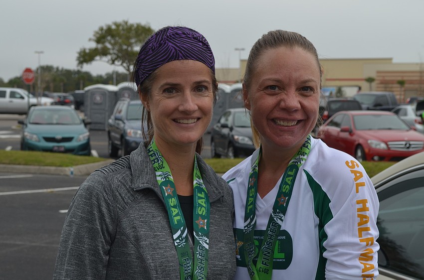 Cindi Soderholm and Amy Brown cool off after the marathon.