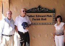 Monsignor Gerard Finegan, the Rev. Edward Pick and Donna Pettinato with the new dedication.