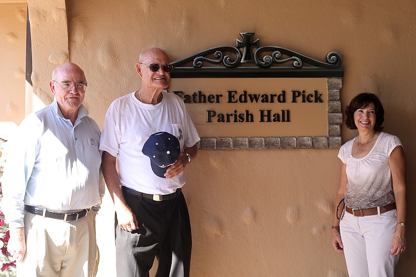 Monsignor Gerard Finegan, the Rev. Edward Pick and Donna Pettinato with the new dedication.