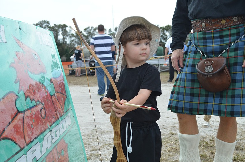 Wolfy Stadler slays the dragon with his bow and arrow.