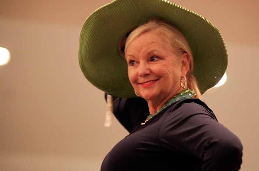 Phyllis Black shows off a hat from Main Street Traders.
