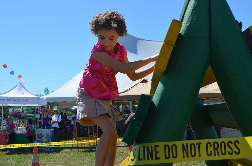 Lilly Mae Stewart does the SWAT obstical course.