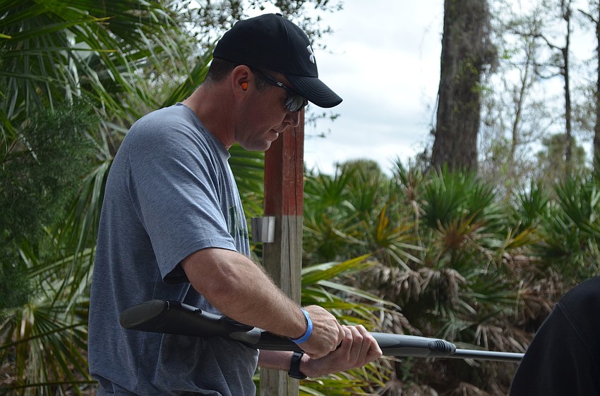 Jamie Purmort, from Purmort and Martin Insurance, reloads.