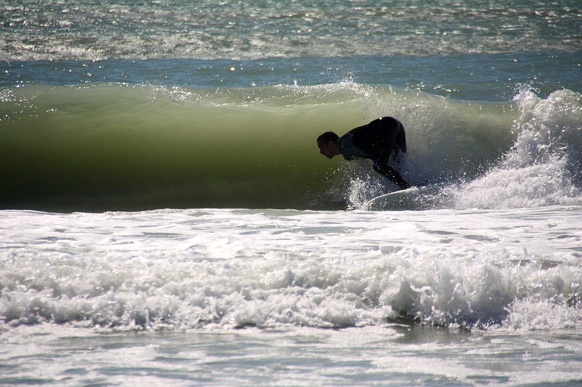 Surfers at Lido Beach.