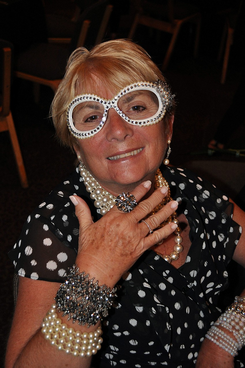 Nancy Ausburger bejeweled and feathered a pair of sunglasses from the Womanâ€™s Exchange to wear to the volunteer luncheon.