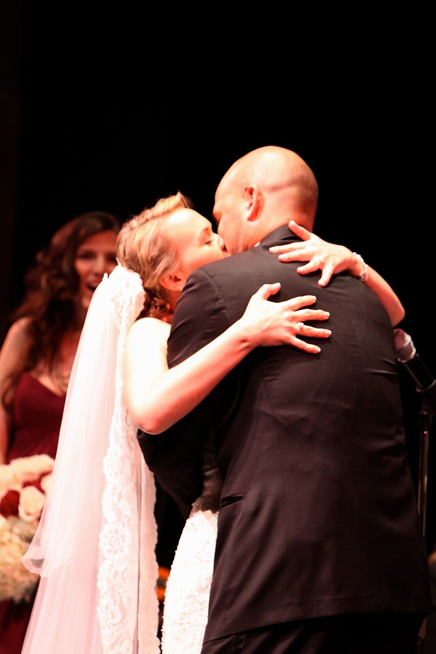 Emily Forbes and Joseph Sckowska share in their first kiss as Mr. and Mrs. Sckowska.