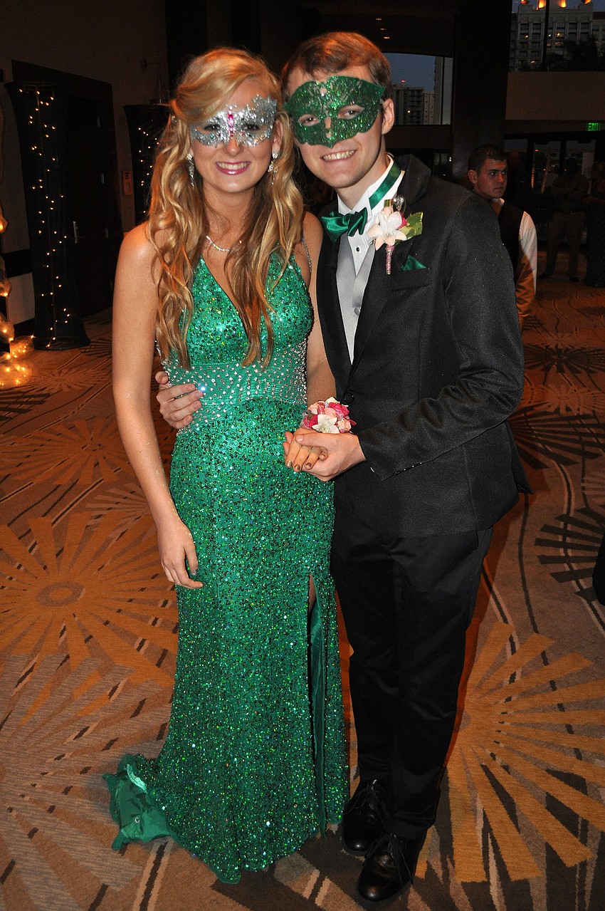 Jillian Smith and Casey Rich brought their own masks to the prom and were proud of that their prom attire showed their Lakewood Ranch school spirit.