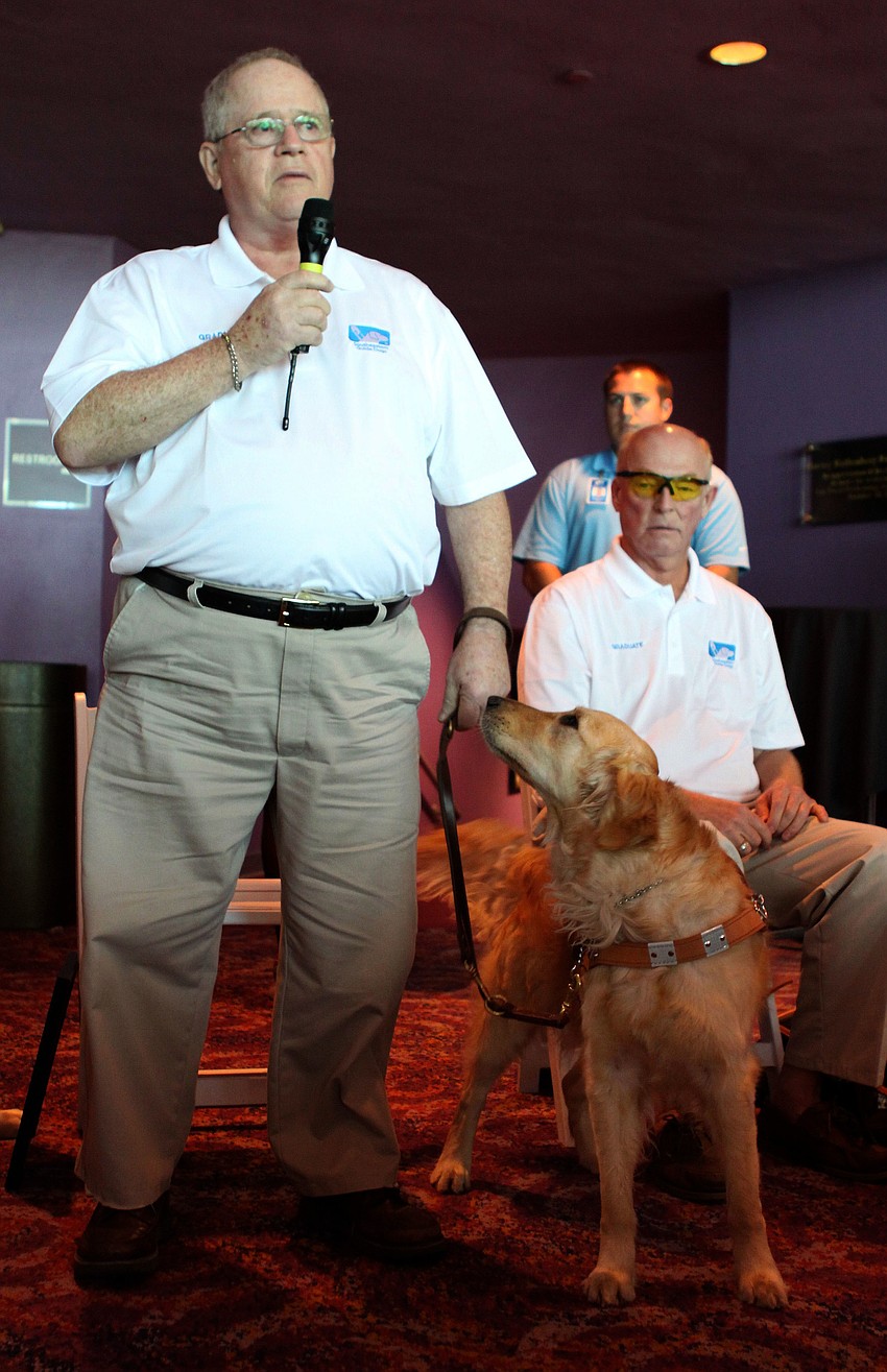 George Rorick talks to the crowd about his experience at Southeastern Guide Dogs and his new guide, Perle.