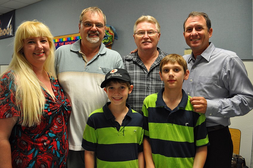 Noemi and Laszlo Szilagyi and their children, Peter and Adam, introduced Larry King Foundation benefactor Kevin Halewood and representative Larry King Jr.