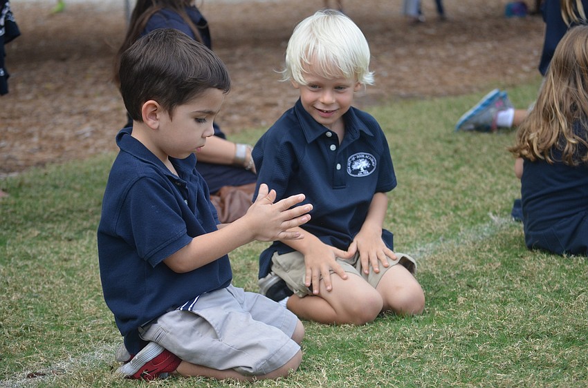 Xavier P. and Levi F. practice their cheering