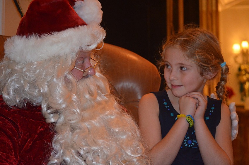 Addison Freeman sits on Santaâ€™s lap