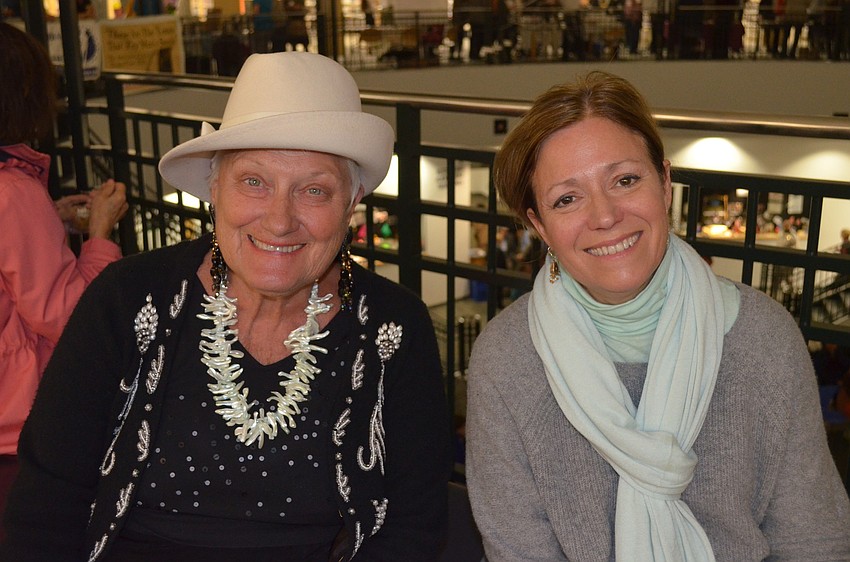Dee Wrigt and Jackie Cutrone wait for a tarot card reading.