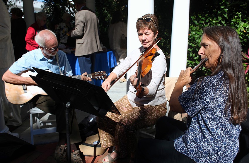 Bill Dudley, Sherry Lowe and Sarah Mitchell entertain parishioners.