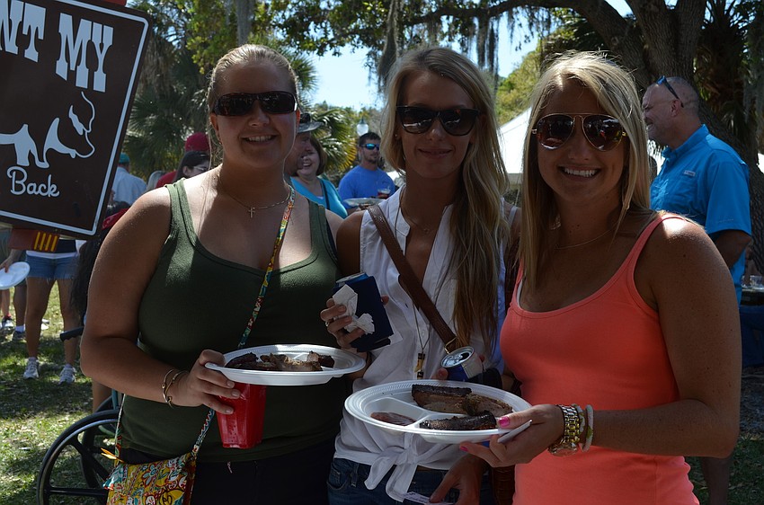 Joni Walker, Amy Brooks and Natalie Shrek pick up some ribs.