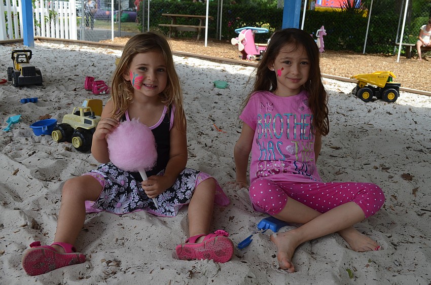 Dani Mallitz and Lily Schlosberg sit together.