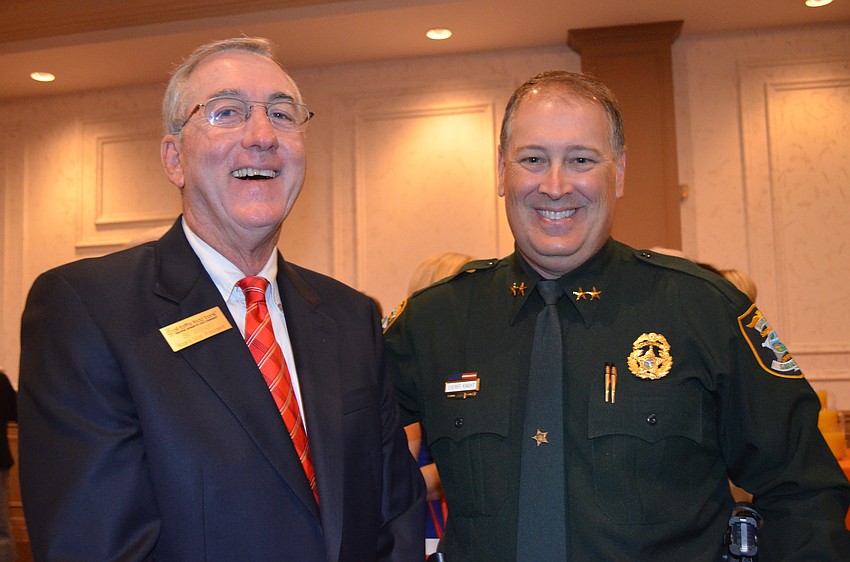 All Faiths Food Bank Board Vice President Bill Wilson with Sheriff Tom Knight
