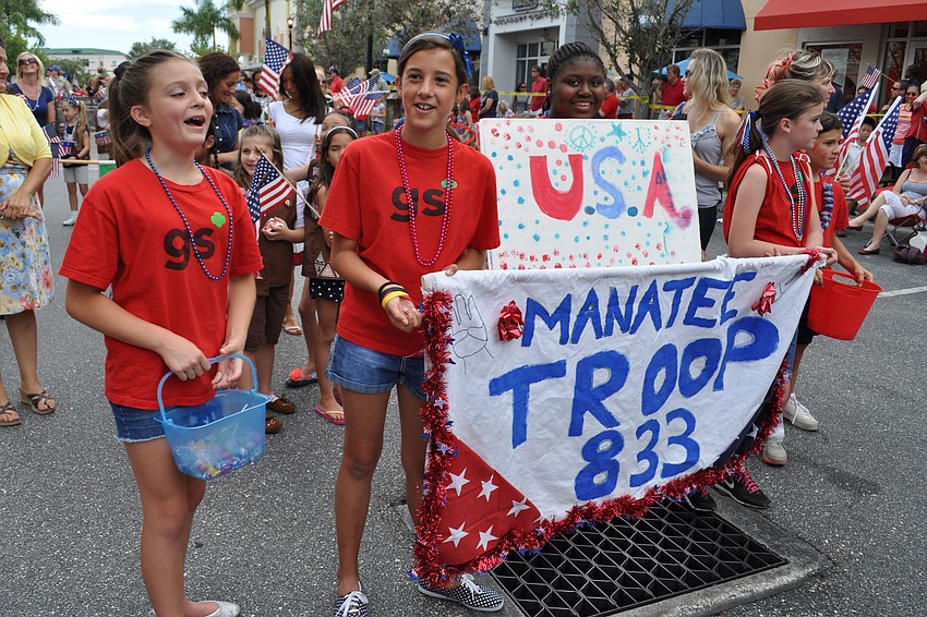 Girl Scout Troop 833 members walk in the parade.