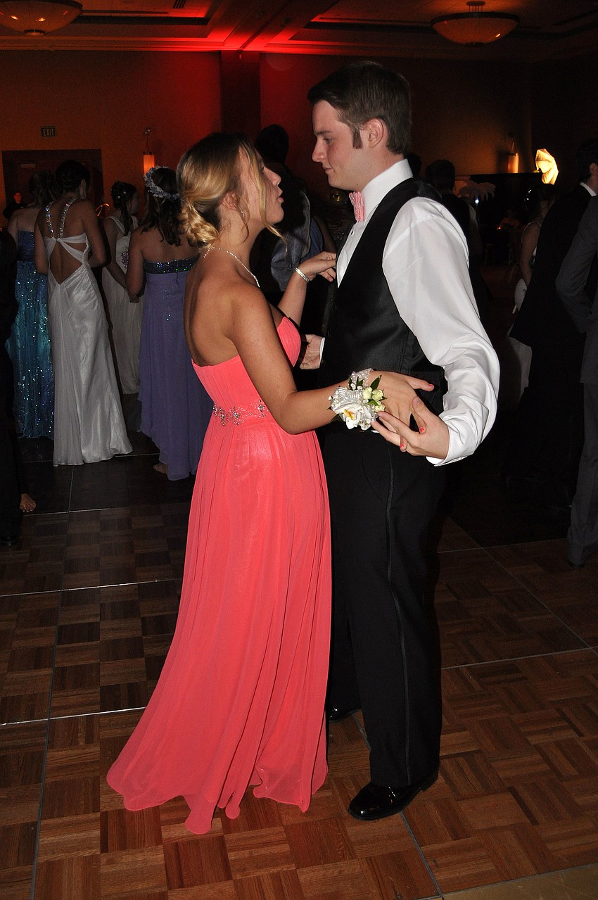 Katie Strickland and Aaron Lamotte dance together on the dance floor.