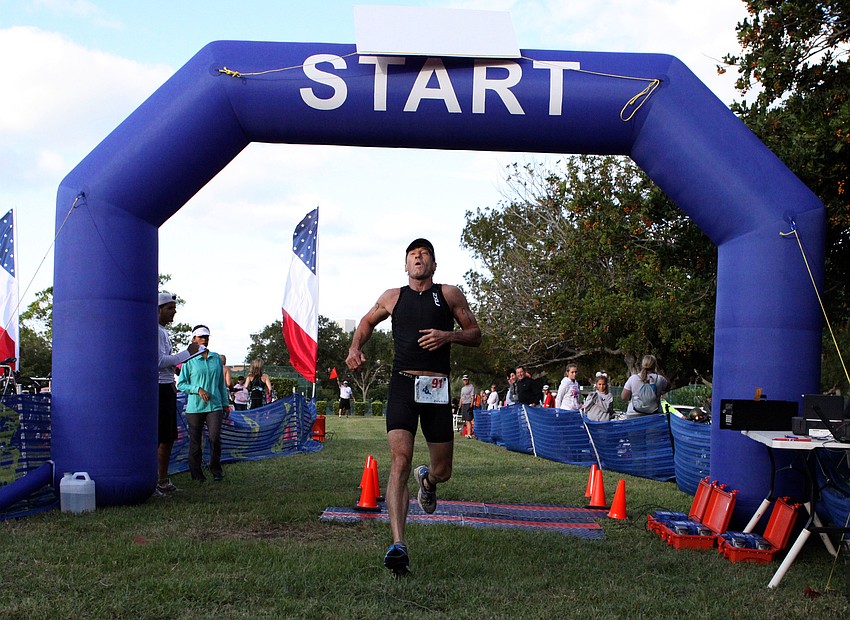 Michael Harris, No. 91, crosses the finish line.