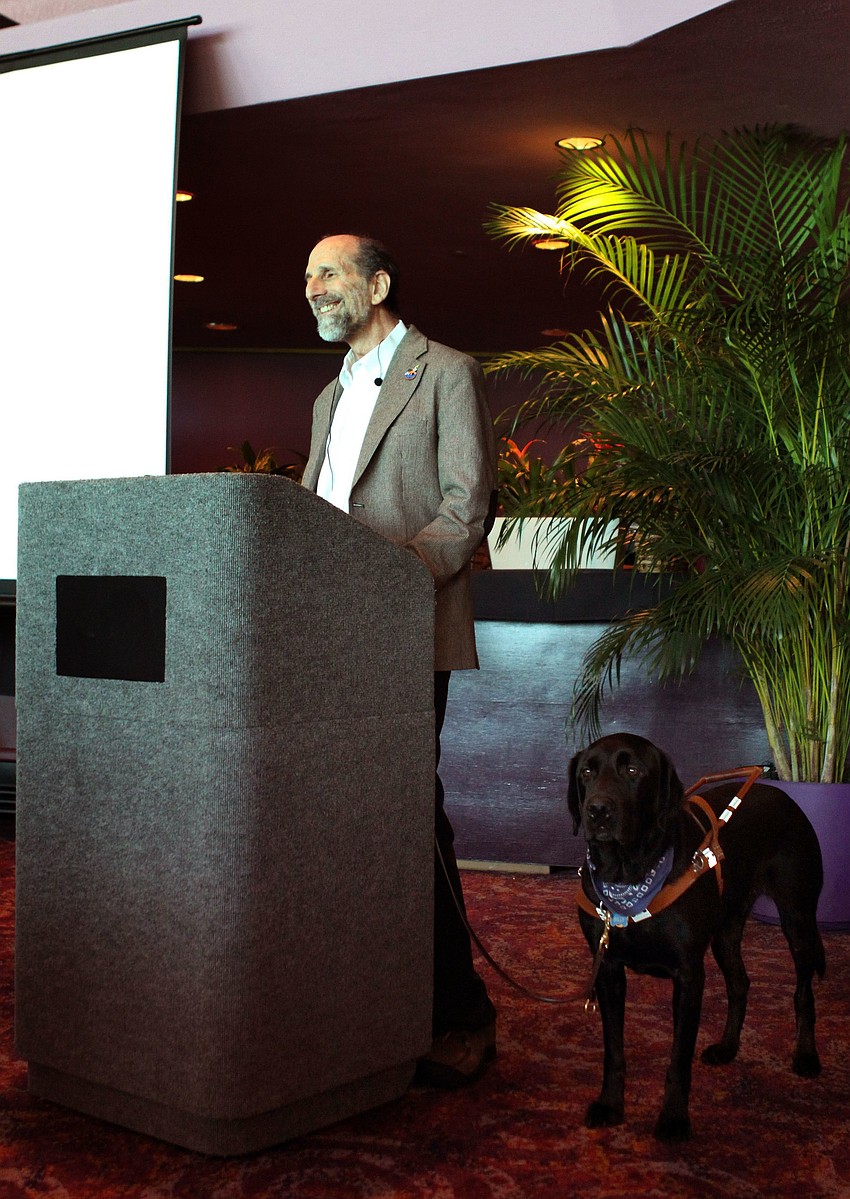 Steve Gladstone, with his guide dog Billy, was the graduate speaker.