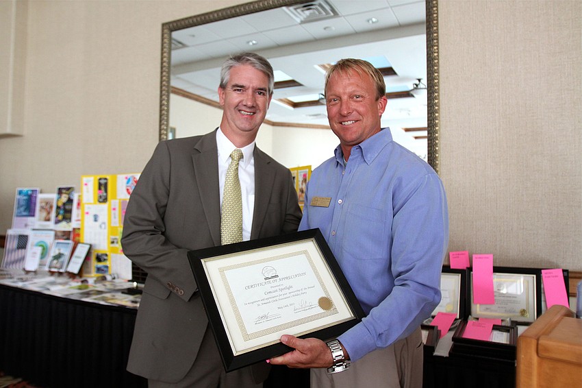 James Maslan with Comcast Spotlight was given an award for Comcast Spotlightâ€™s co-sponsorship of the annual St. Armandâ€™s Cicle Association Holiday Party.