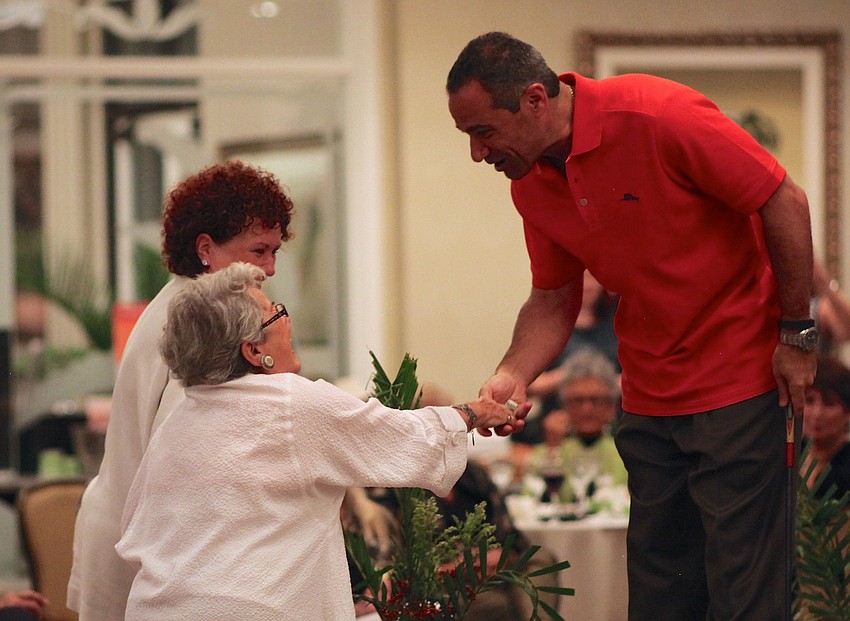 Felipe Cave collects a few donations during his runway walk from the crowd.