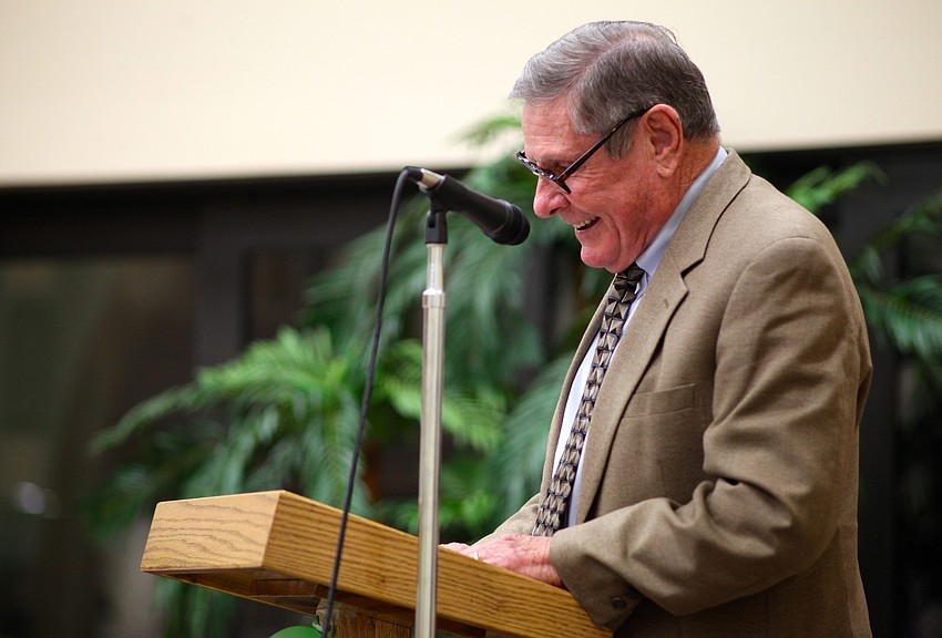 The Rev. Bruce Porter speaks to his congregation a final time during his retirement party.
