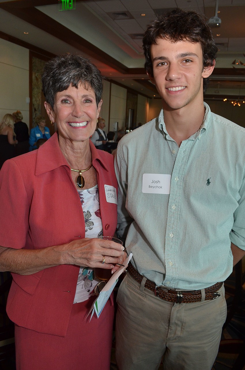 Retired City Commissioner Shannon Staub and Shannon Staub Excellence in Leadership Scholarship recipient Joshua Beychok of Pine View School