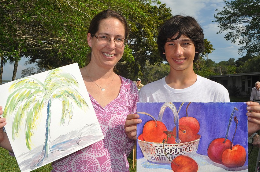 Jennifer Davidhazy and Ty Ozsoy show off their selected paintings