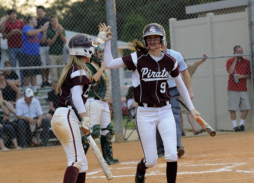 Braden Riverâ€™s Bethany Keen and Shelby Murphy celebrate following Murphyâ€™s run in the bottom of the fourth inning to give the Lady Pirates a 2-0 lead.