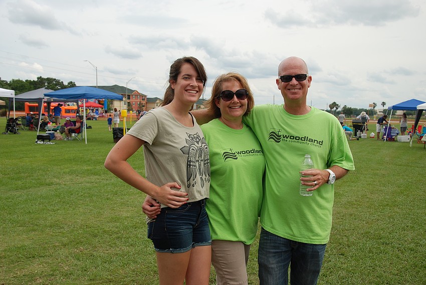 Abby, Jennifer and the Rev. Tim Passmore, pastor at Woodland Community Church