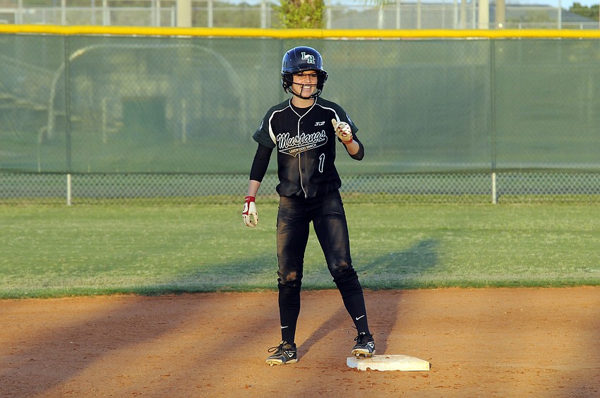 Jackie Schoff celebrates after stealing second base.