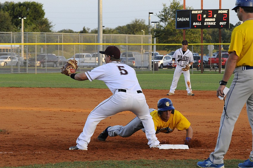 Braden River first baseman John George looks to keep a Charlotte base runner from stealing second base.