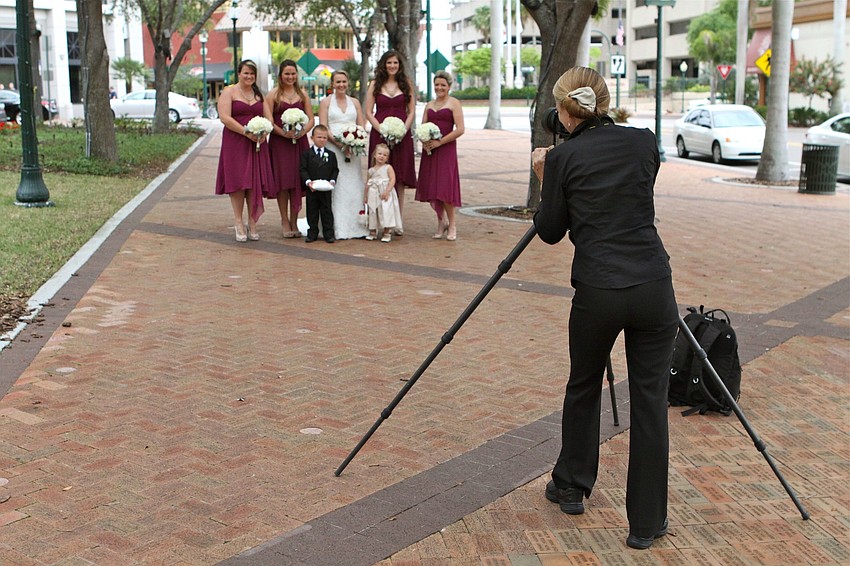 The bride and bridal party pose for photos