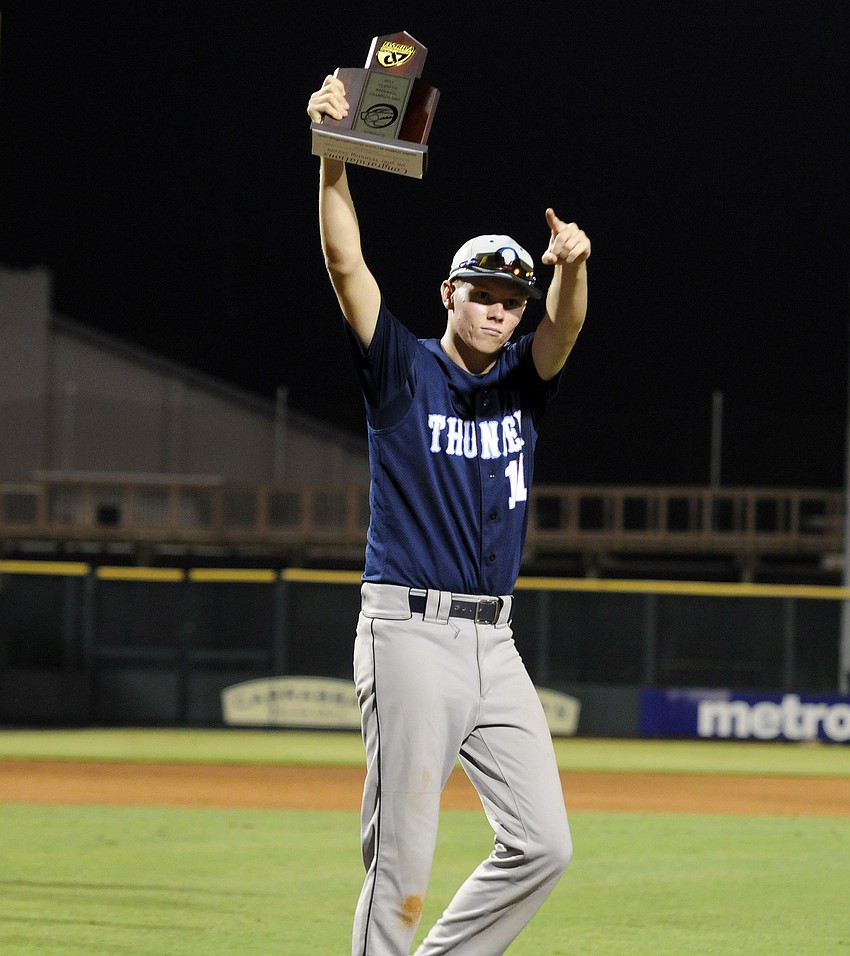 Lone senior Alex Horan receives the district championship trophy following ODAâ€™s 11-3 victory over Cardinal Mooney April 26.