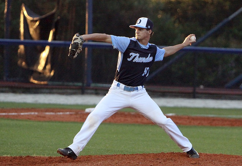 Out-of-Door Academyâ€™s Austin Hoppe, No. 12, pitches the ball during Thursday nightâ€™s game.
