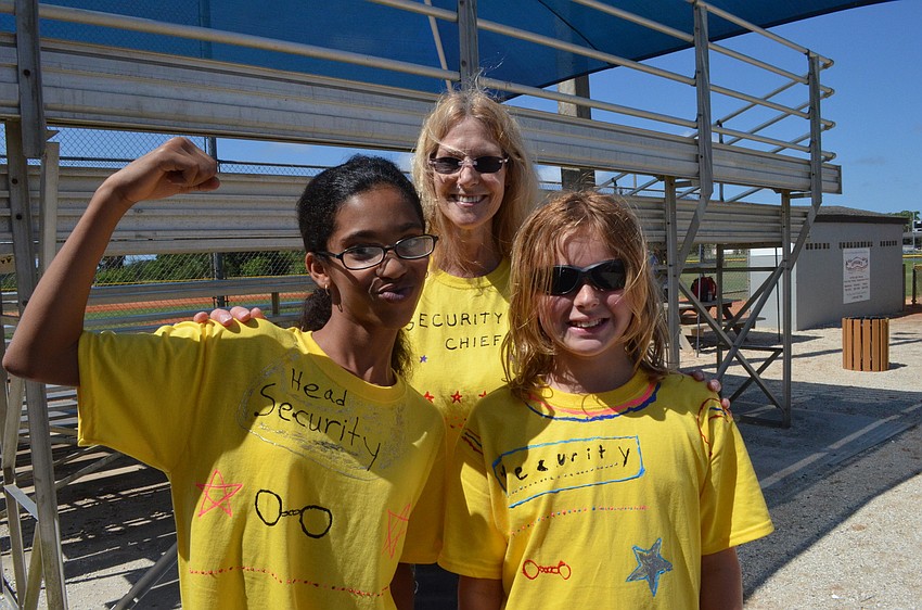 Aaliyah Thompson, fifth grade teacher Carrie Ross and Lily Spencer played the part of security at the baseball games.