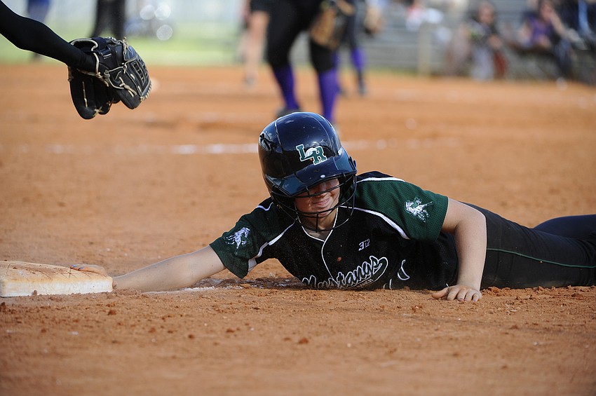Sophomore Talli Sharp slides back safely into third base.