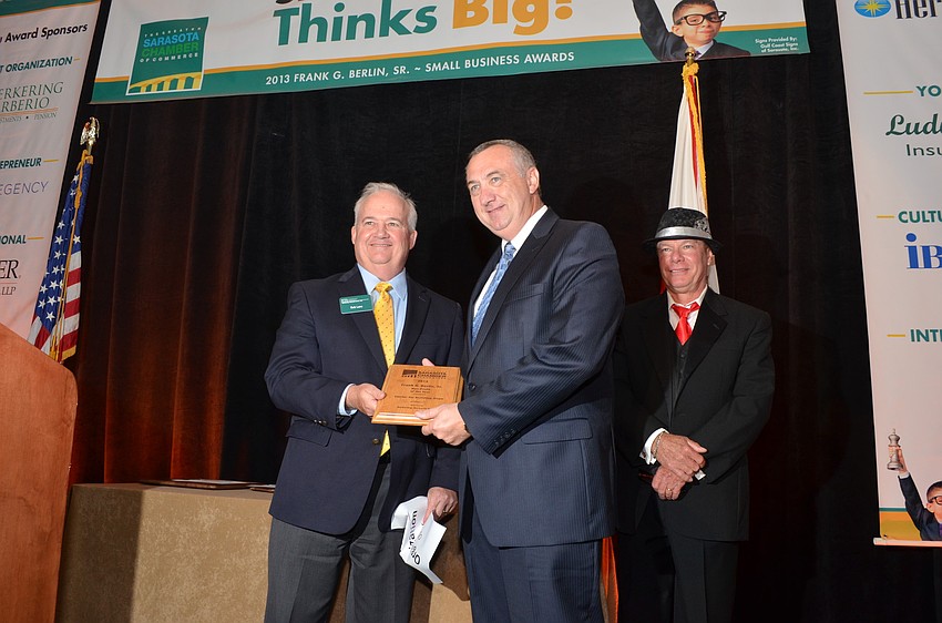 Rob Lane of Kerkering, Barberio & Co. presents Bill Russell of Center for Building Hope with the Non â€“ Profit Organization of the Year Award.